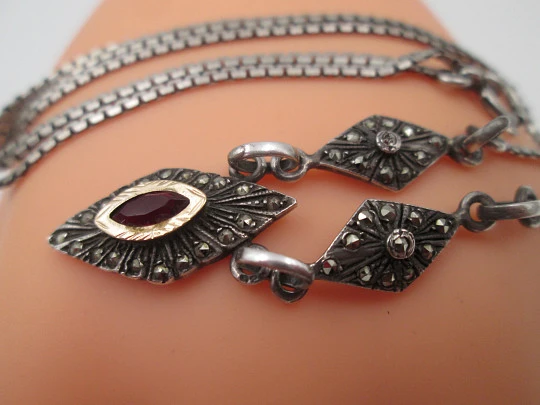 Women's sterling silver necklace and ring set. Marcasite stones, gold and garnet gems Women's sterling silver necklace and ring set. Marcasite stones, gold and garnet gems