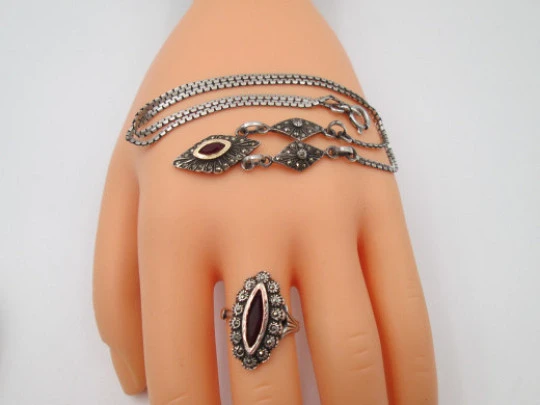 Women's sterling silver necklace and ring set. Marcasite stones, gold and garnet gems Women's sterling silver necklace and ring set. Marcasite stones, gold and garnet gems