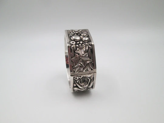 Women's wide bangle. Sterling silver. Roses, ears of wheat, leaves and fruit in relief. 1970's