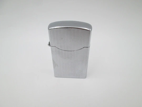 Zenith Windproof petrol pocket lighter. Chromed metal. Linear pattern. Japan. 1960's