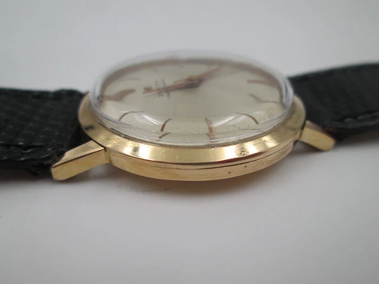 Zenith. 18 karat yellow gold. Automatic movement. Black leather strap. 1960's. Swiss