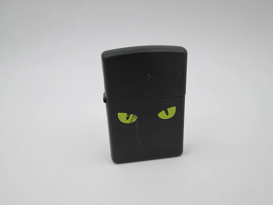 Zippo Cat's Eyes petrol pocket lighter. Chromed metal and black enamel. 2010