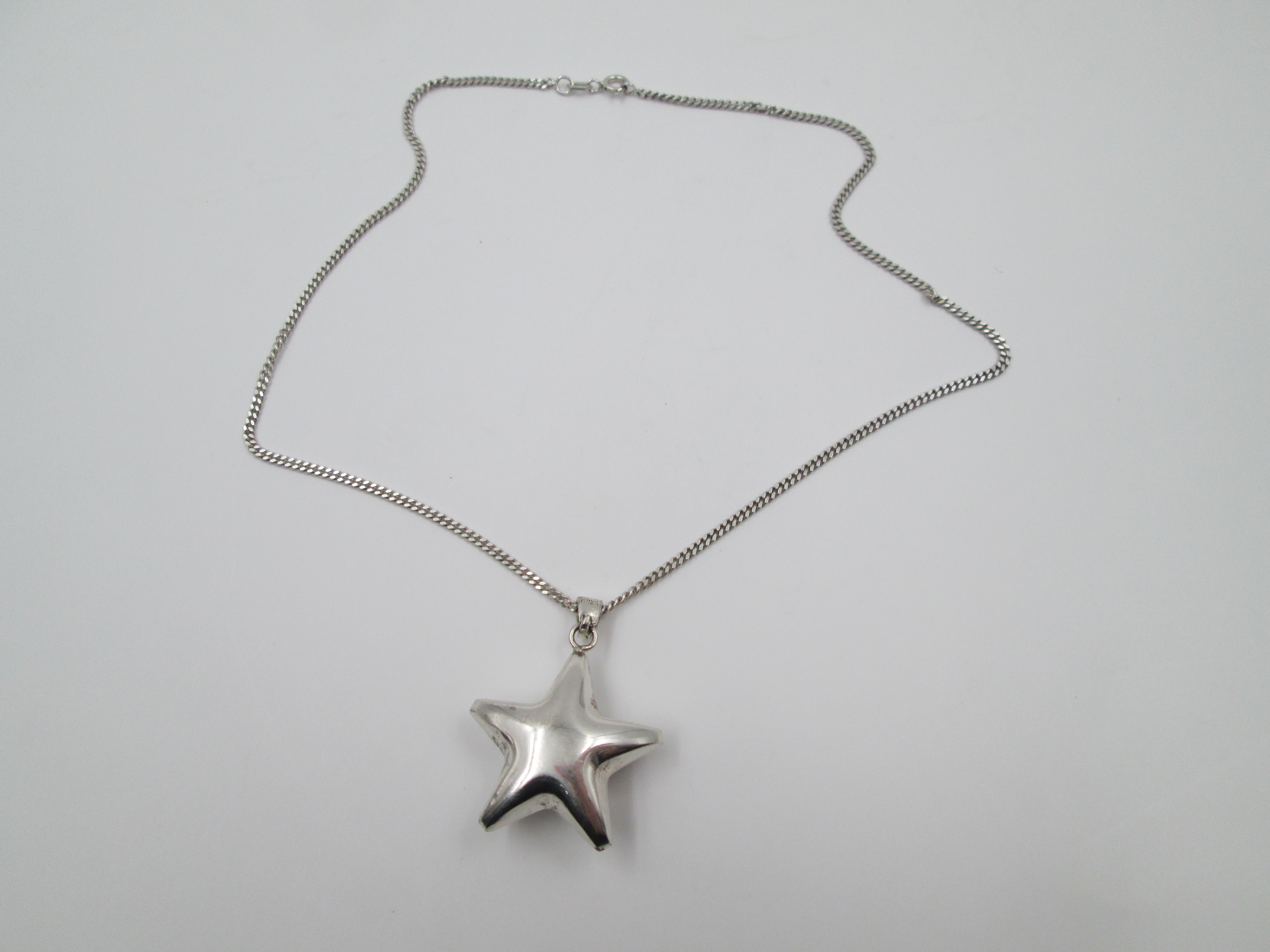 Jingle Bell Star Pendant With Braided Chain Sterling Silver