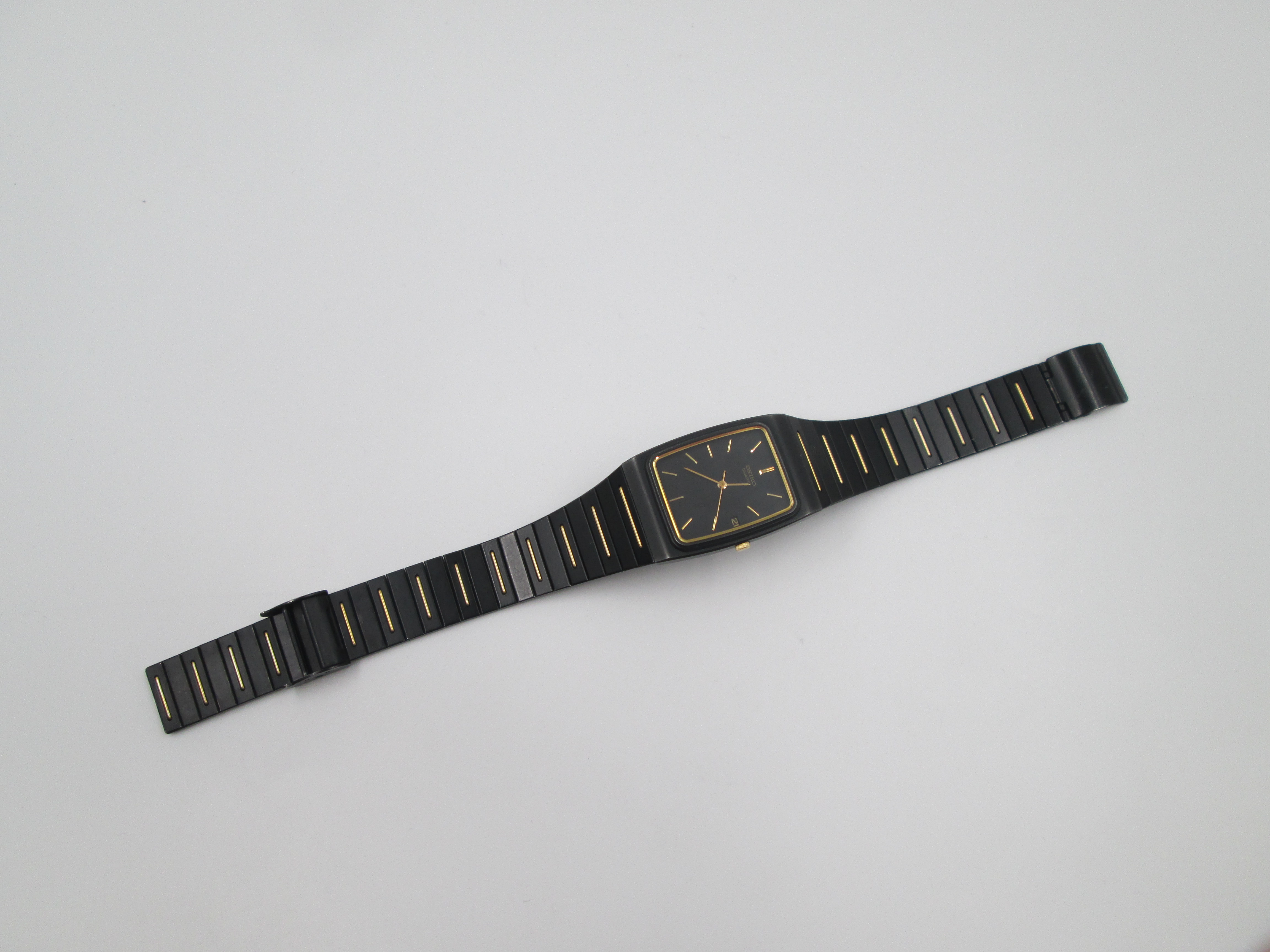 seiko black gold metal and steel quartz square case 1980s