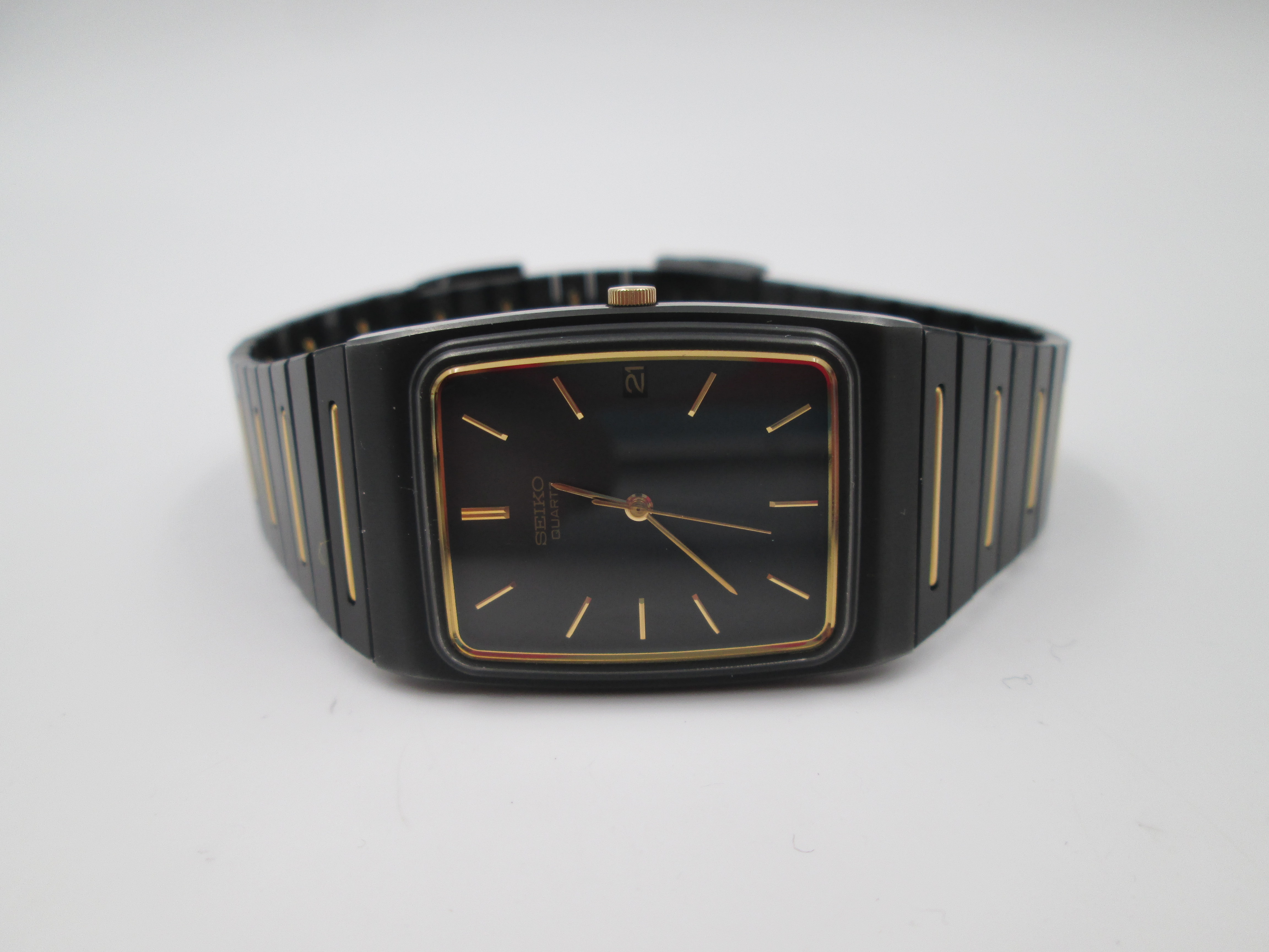 seiko black gold metal and steel quartz square case 1980s