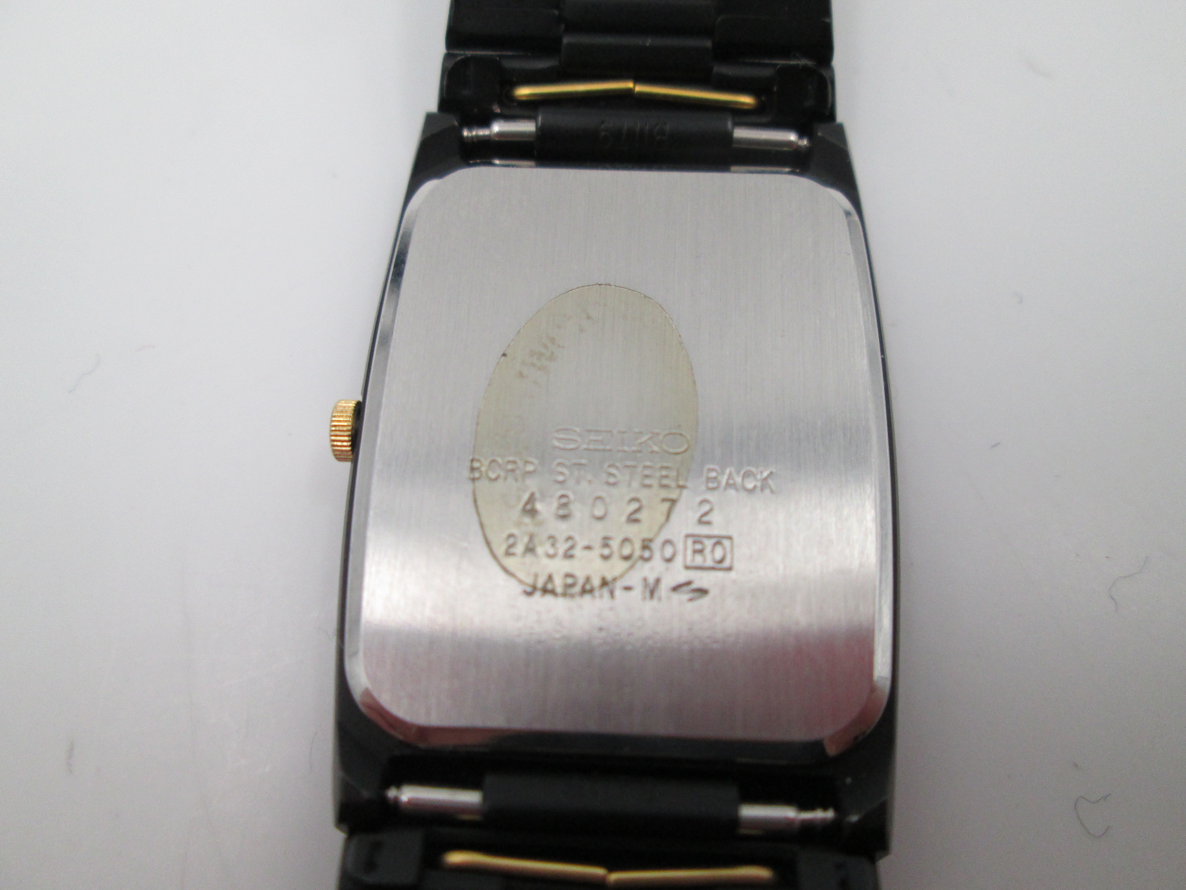 seiko black gold metal and steel quartz square case 1980s