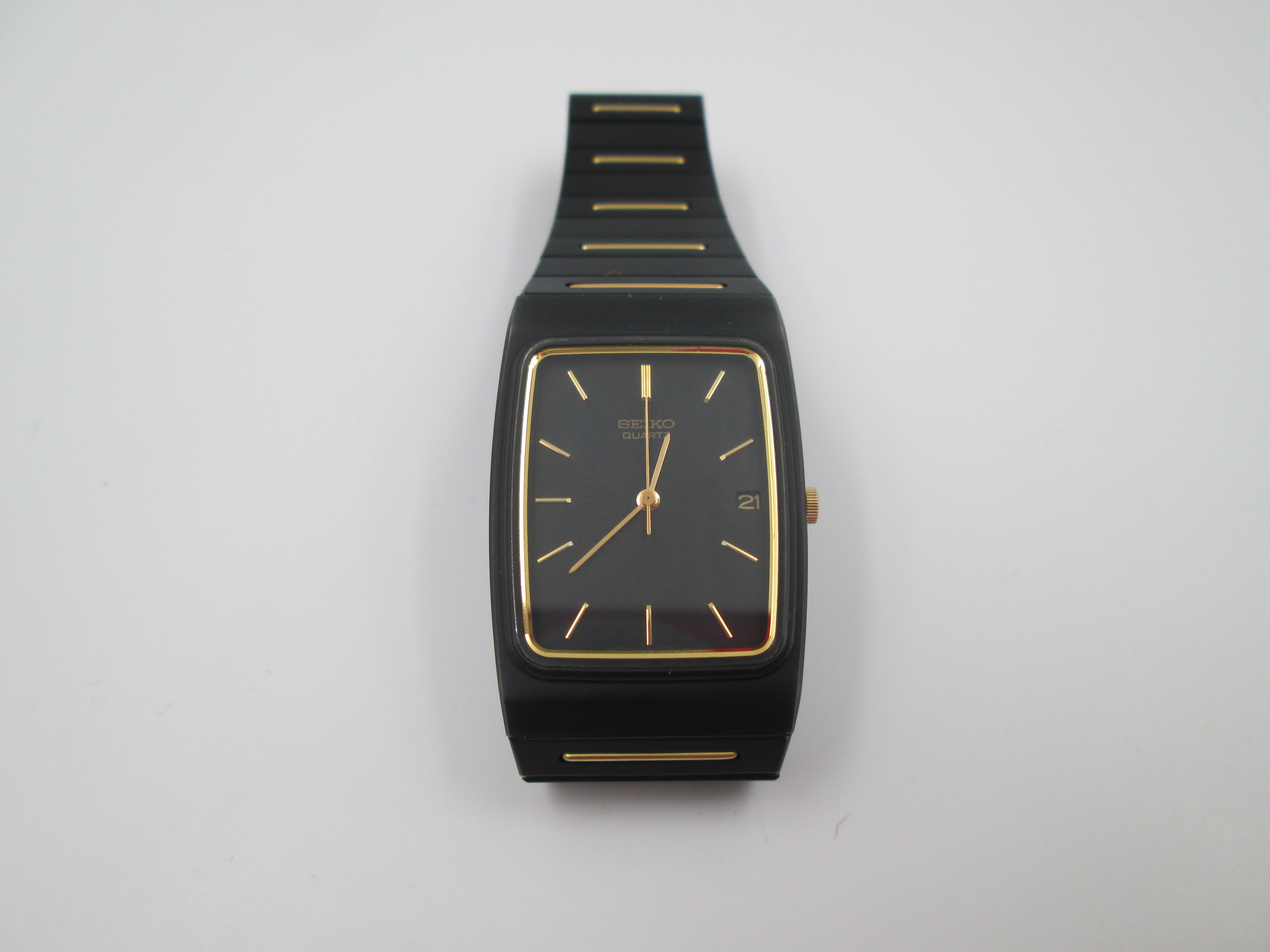 seiko black gold metal and steel quartz square case 1980s